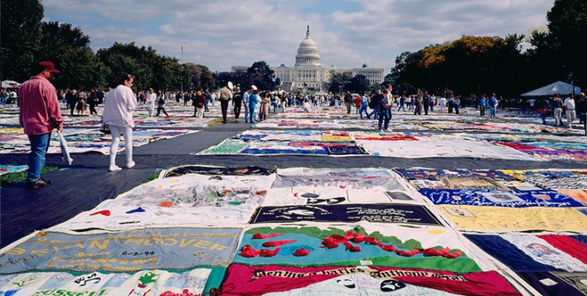 photo of the AIDS quilt displayed on the Capitol Lawn in Washington, DC.