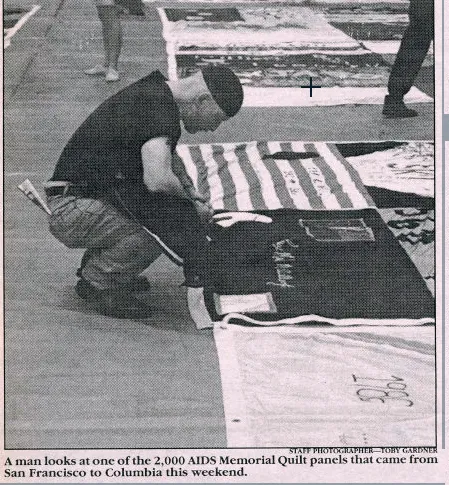 A man looks at one of the 2,000 AIDS Memorial Quilt panels that came from San Francisco to Columbia University.